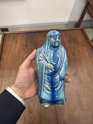 Lot 34 - A Chinese monochrome turquoise-glazed figure of Daruma, Qing dynasty, Kangxi period