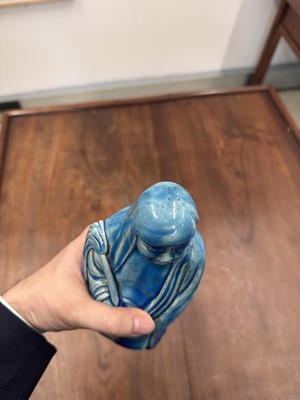 Lot 34 - A Chinese monochrome turquoise-glazed figure of Daruma, Qing dynasty, Kangxi period