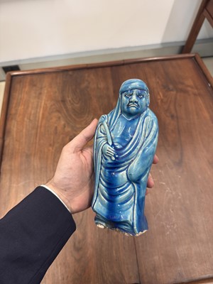 Lot 34 - A Chinese monochrome turquoise-glazed figure of Daruma, Qing dynasty, Kangxi period