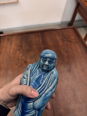 Lot 34 - A Chinese monochrome turquoise-glazed figure of Daruma, Qing dynasty, Kangxi period