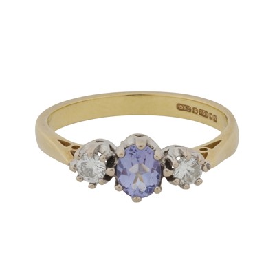 Lot 449 - A tanzanite and diamond three stone ring