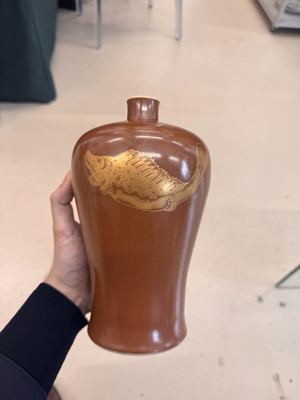 Lot 83 - A Chinese gilt-decorated cafe au lait-glazed 'fish' vase, Qing dynasty, 18th century