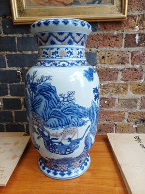 Lot 94 - A large Chinese underglaze-copper-red and blue lantern vase, Qing dynasty, 19th century
