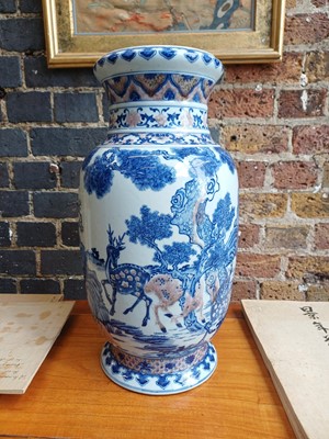 Lot 94 - A large Chinese underglaze-copper-red and blue lantern vase, Qing dynasty, 19th century