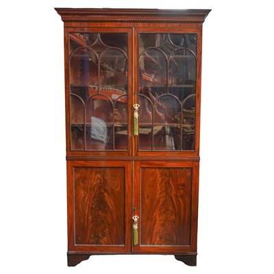 Lot 22 - A flame mahogany glazed bookcase, first half of the 19th century