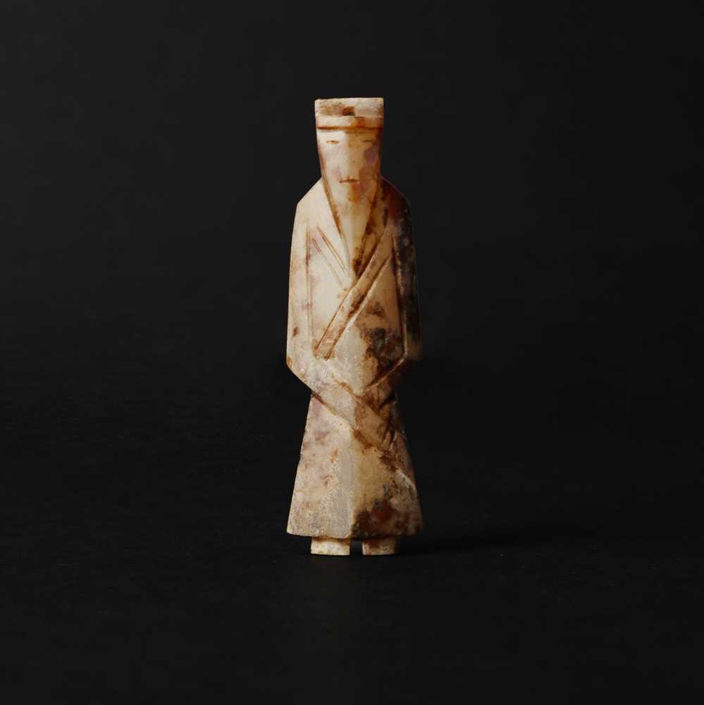 Lot 537 - A Chinese archaistic jade figure of a scholar, 18th/19th century or earlier
