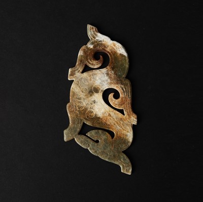 Lot 540 - A Chinese archaistic jade 'dragon' plaque, 18th/19th century or earlier