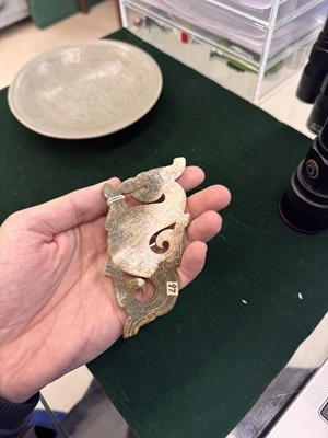 Lot 540 - A Chinese archaistic jade 'dragon' plaque, 18th/19th century or earlier