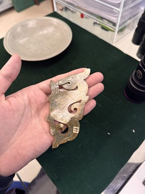 Lot 540 - A Chinese archaistic jade 'dragon' plaque, 18th/19th century or earlier