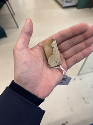 Lot 533 - A Chinese archaistic jade sword slides, 18th/19th century or earlier