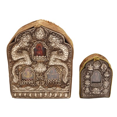 Lot 586 - Two Tibetan metal repousse travelling shrines, gau, 19th/20th century