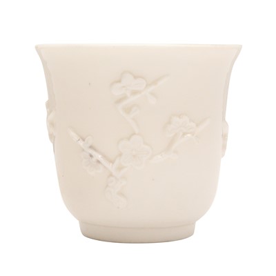 Lot 600 - A Chinese Dehua 'prunus' libation cup, Qing dynasty, Kangxi period