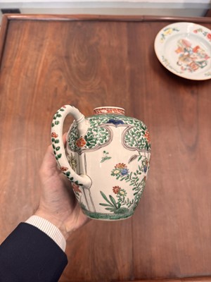 Lot 23 - A Chinese famille-verte 'floral' teapot, Qing dynasty, Kangxi period