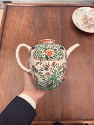 Lot 23 - A Chinese famille-verte 'floral' teapot, Qing dynasty, Kangxi period