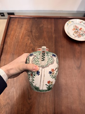 Lot 23 - A Chinese famille-verte 'floral' teapot, Qing dynasty, Kangxi period