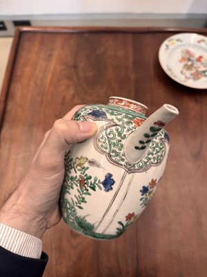 Lot 23 - A Chinese famille-verte 'floral' teapot, Qing dynasty, Kangxi period