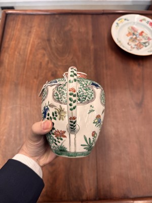 Lot 23 - A Chinese famille-verte 'floral' teapot, Qing dynasty, Kangxi period