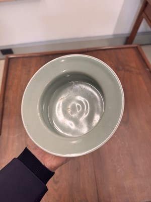 Lot 87 - A Chinese celadon-glazed washer, Qing dynasty