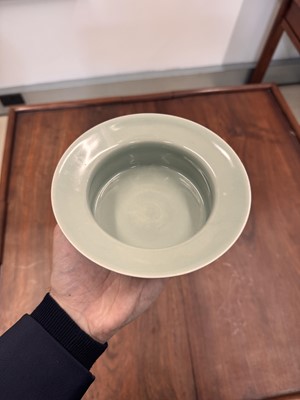 Lot 87 - A Chinese celadon-glazed washer, Qing dynasty