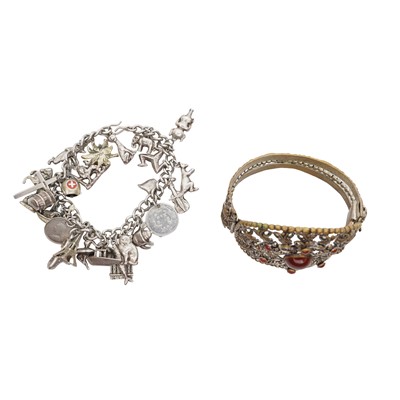 Lot 118 - A silver charm bracelet and a carnelian bangle