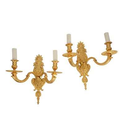 Lot 289 - A pair of Louis XVI style gilt metal two light wall appliques