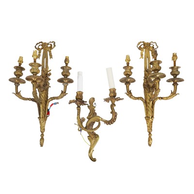 Lot 291 - A pair of Louis XVI style gilt metal wall appliques and a Rococo style two-light example, 20th century