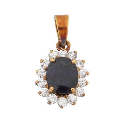 Lot 12 - A sapphire and diamond halo pendant