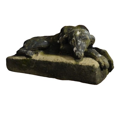 Lot 90 - A reconstituted stone model of a recumbent hound, 20th century