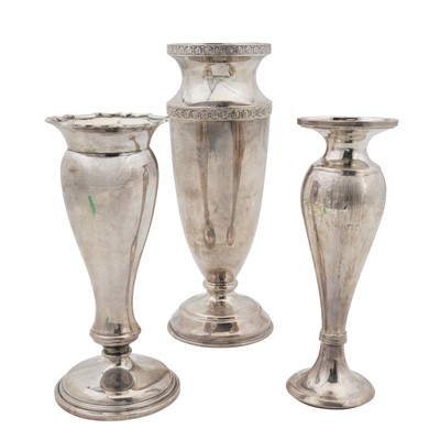 Lot 654 - Three sterling silver posy vases