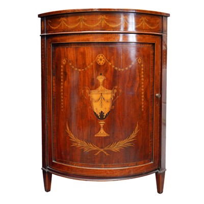 Lot 21 - Attributed to Edwards & Roberts, an Edwardian mahogany and satinwood inlaid bowfront corner cabinet