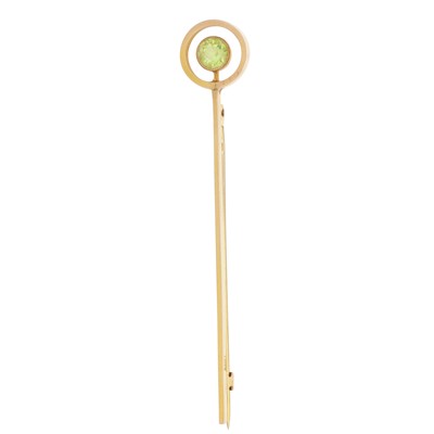 Lot 198 - A peridot bar brooch