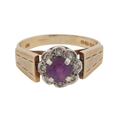 Lot 472 - An amethyst and diamond halo ring
