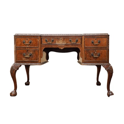 Lot 25 - A burr walnut free standing kneehole 'Maples' writing desk