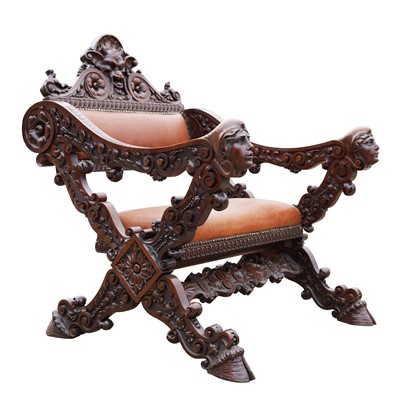 Lot 63 - A carved walnut Savonarola armchair