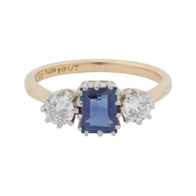 Lot 21 - A sapphire and diamond three stone ring