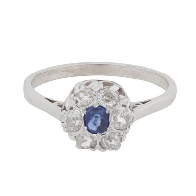 Lot 13 - A sapphire and diamond halo ring