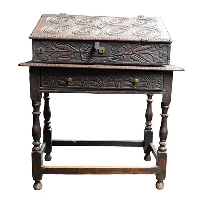 Lot 27 - A carved oak writing slope or bible box