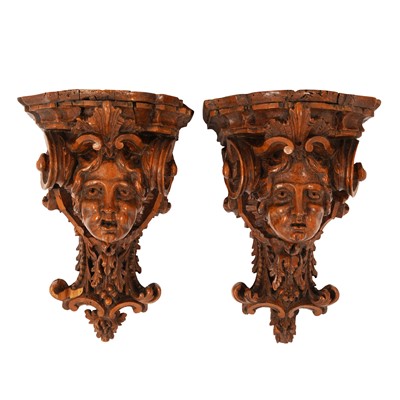 Lot 52 - A pair of Italian carved walnut figural wall brackets