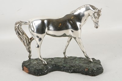 Lot 355 - A silvered model of a stallion.