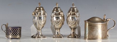 Lot 22 - A set of three Victorian silver peppers of neo-...