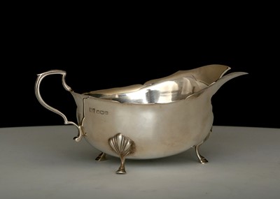 Lot 323 - Antique George VI Sterling Silver sauce boat...