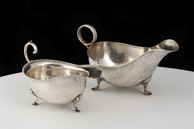 Lot 216 - Two Antique Sterling Silver sauceboats, one by...