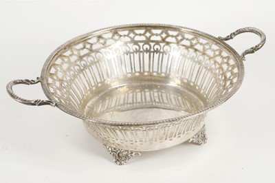 Lot 442 - A George V silver twin handled pierced basket...