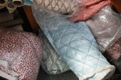 Lot 453 - A selection of quilted fabrics, some already...