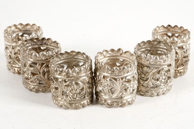 Lot 509 - A set of 6 white metal napkin rings, pierced...