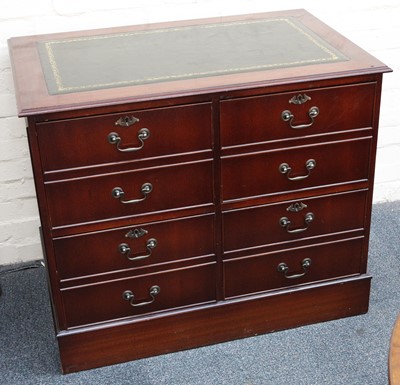 Lot 823 - A leather top locking double filing cabinet,...