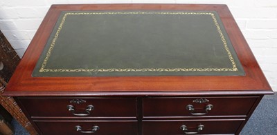 Lot 823 - A leather top locking double filing cabinet,...
