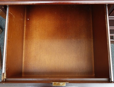 Lot 823 - A leather top locking double filing cabinet,...