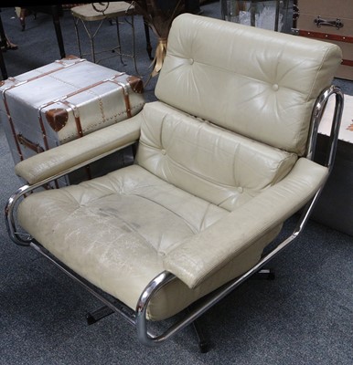 Lot 820 - A 1970's cream leather and chrome swivel chair.