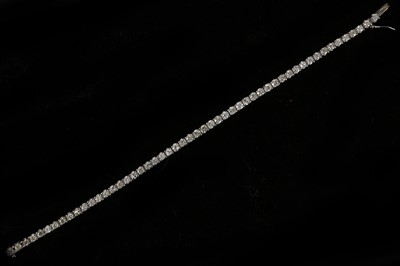 Lot 572 - An 18ct white gold and diamond set line...